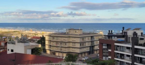 Flat vista mar com limpeza diária e roupa de cama e banho incluídas